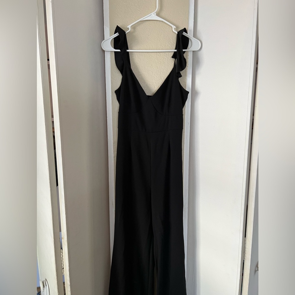 Black pantsuit with ruffle sleeve